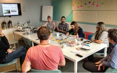Image showing people sitting around a table at Esmee Fairbairn Foundation