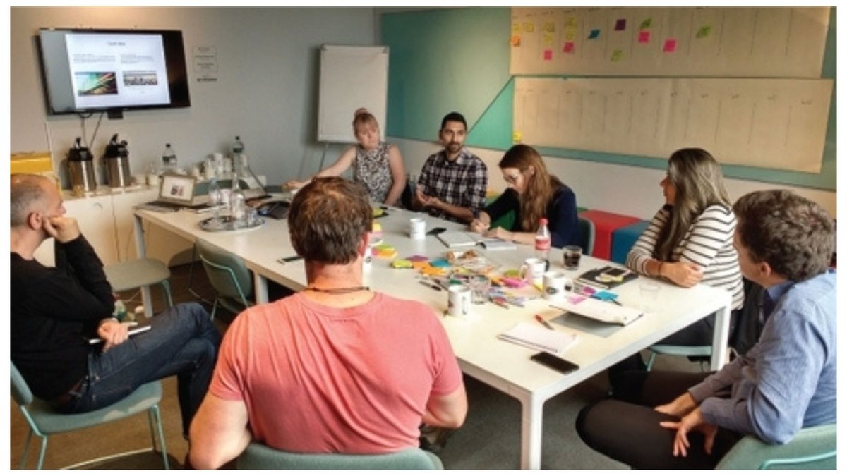 Image showing people sitting around a table at Esmee Fairbairn Foundation